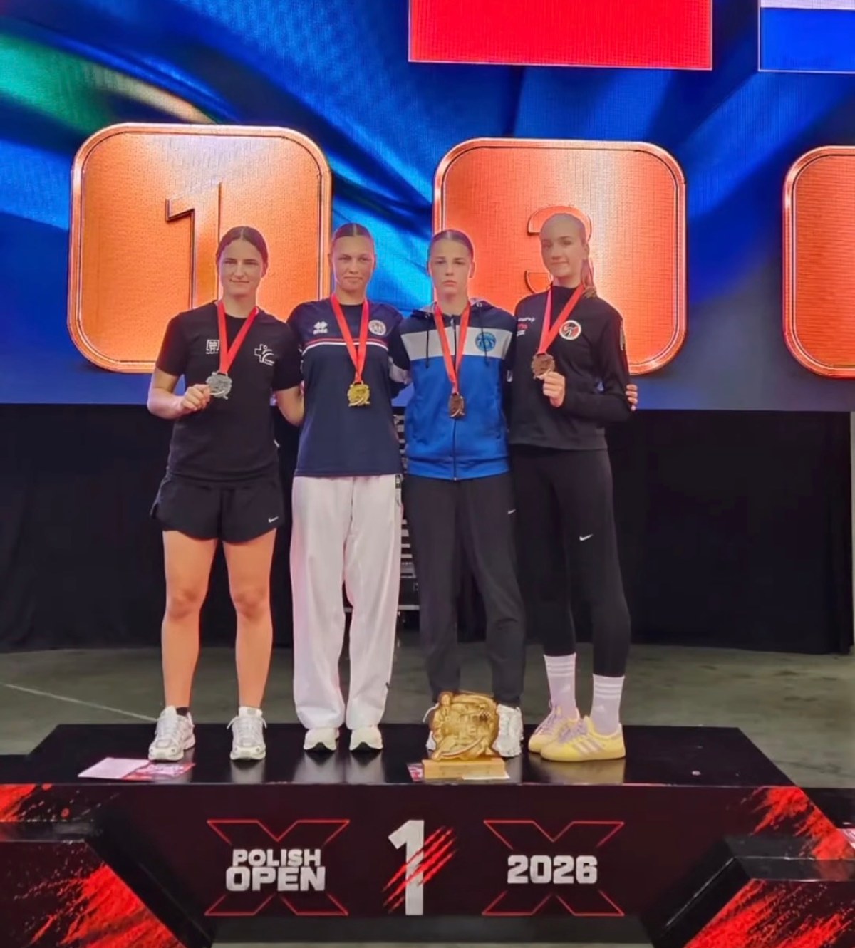 The Junior Kumite Female -66 kg podium at the Polish Open 2026, with Ise van Bommel among the bronze medallists